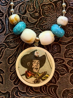 CMC Comic Pendant - Roy's Gotta Gun